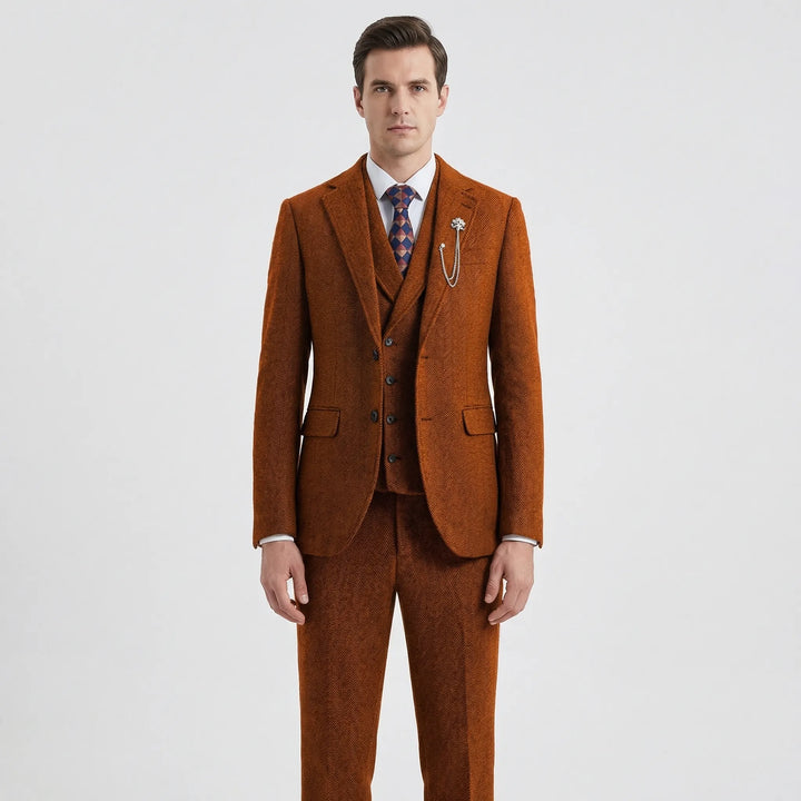 Sharp, tailored men's herringbone 3-piece suit on a mannequin, highlighting the classic style & quality fit.