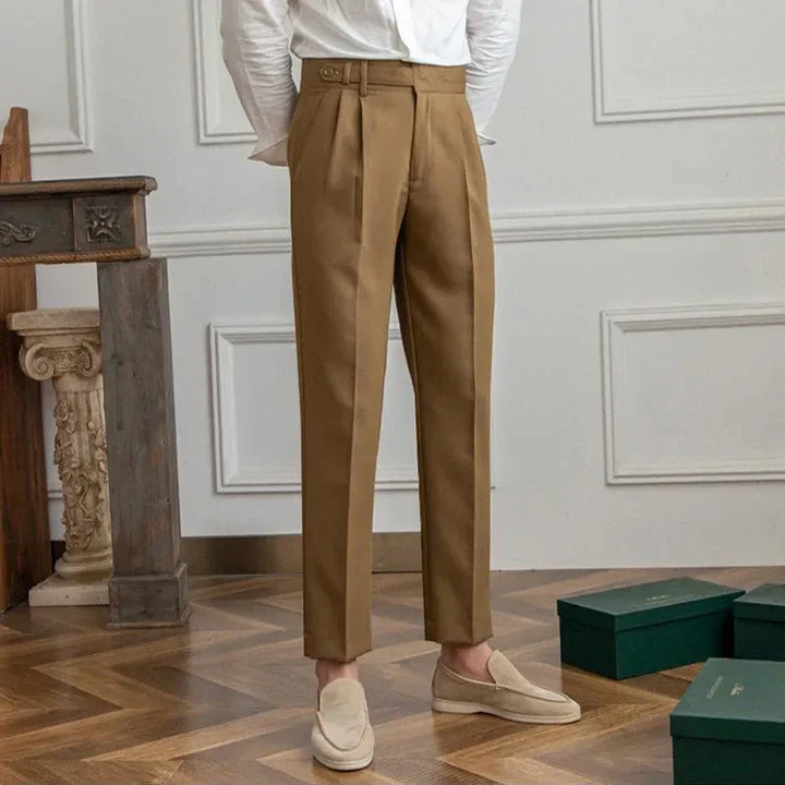 Detailed shot of the waistband on men's high-rise straight leg dress pants, emphasizing tailoring