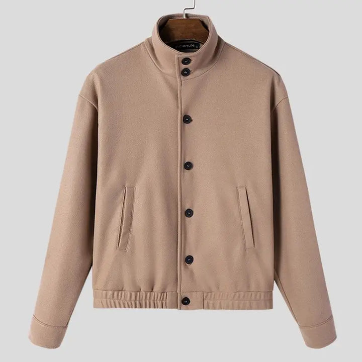 Close-up of a men's classic wool bomber jacket fabric, showcasing its quality and texture