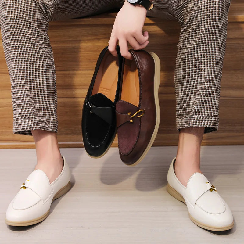 Elegant men's footwear: polished leather loafers with a shining gold bit, a timeless classic style statement