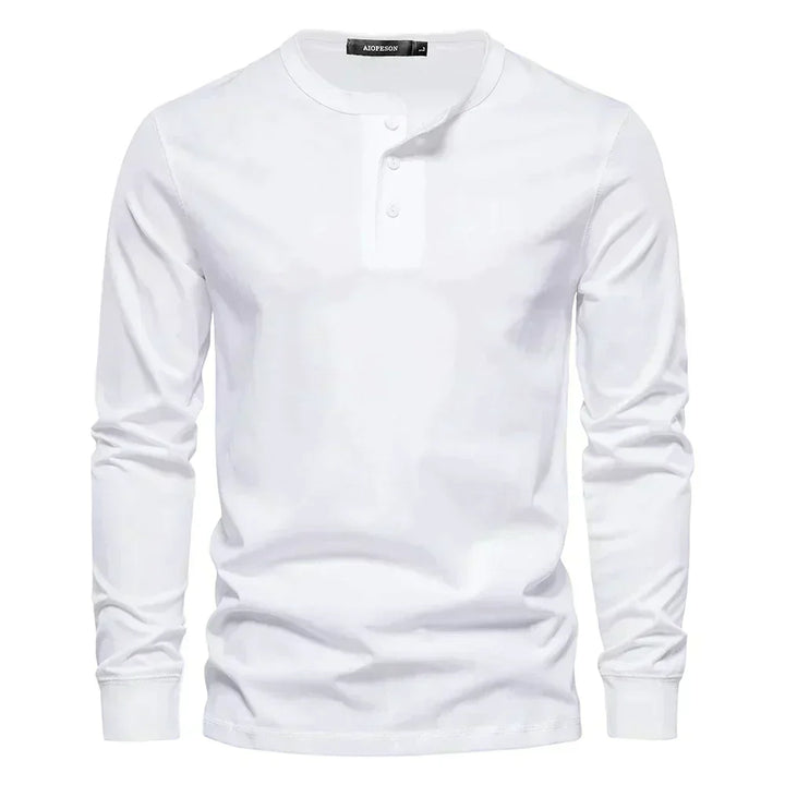 Model wearing a men's long sleeve henley shirt, showcasing its casual fit and style.