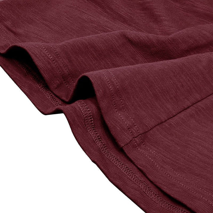 Stylish combination: men's long-sleeve henley shirt paired with jeans, emphasizing casual versatility