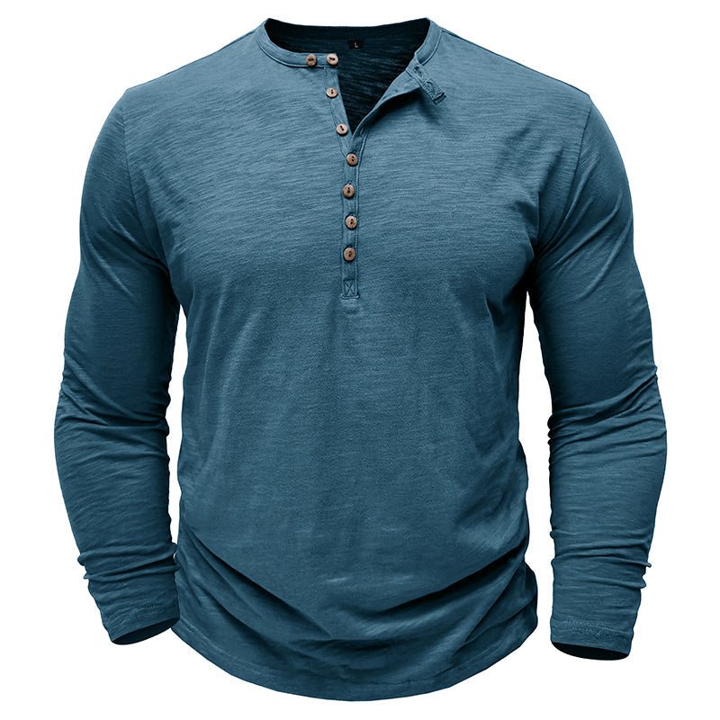 Man wearing a classic black long-sleeve henley shirt, showcasing casual and comfortable men's fashion