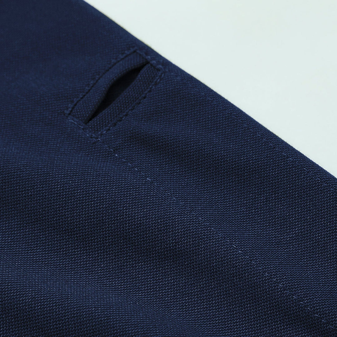 Back view of a black men's long sleeve polo, emphasizing its comfortable, breathable design.