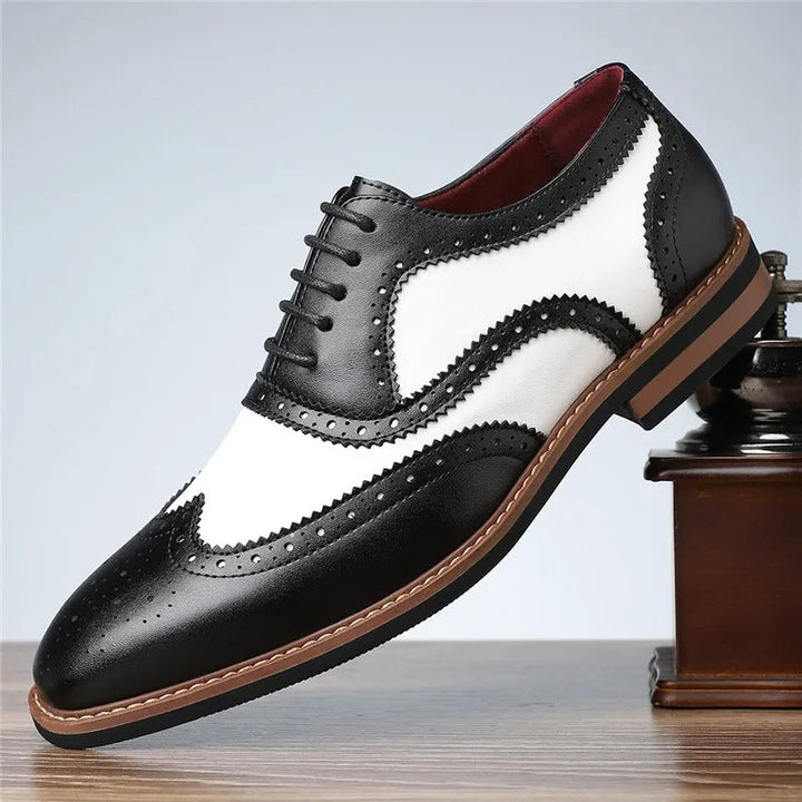 Formal men's two-tone wingtip dress shoes with brogue detailing, ideal for elegant fashion
