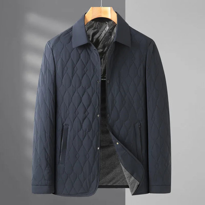 Comfortable men's quilted jacket with button-down front, essential casual outerwear for cool seasons.