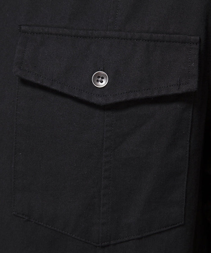 Side profile of a man wearing a comfortable short sleeve cotton blend casual shirt.