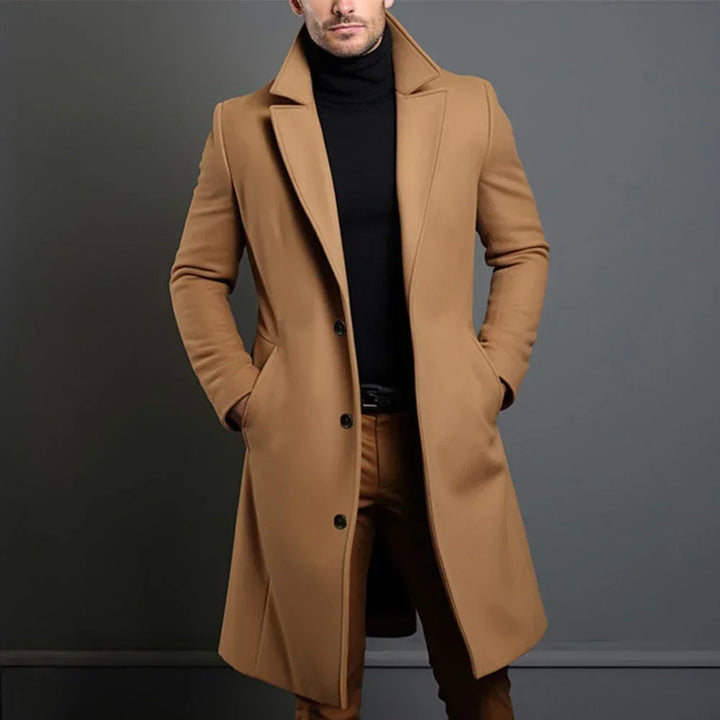 Men's classic single-breasted dark gray overcoat for formal wear & business attire, a tailored long coat.