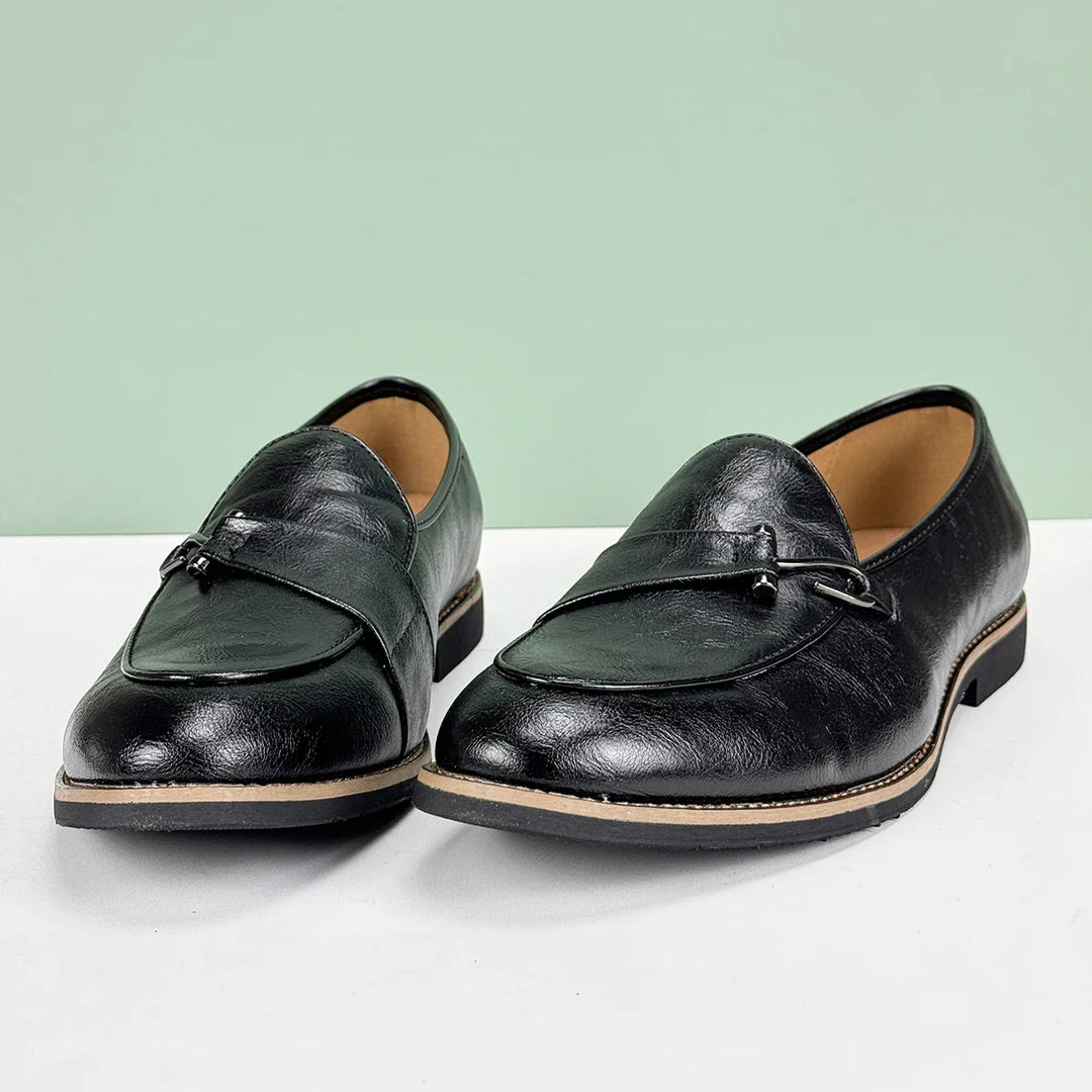 Pair of men's slip-on bit loafers, elegant brown leather for dress casual outfits.