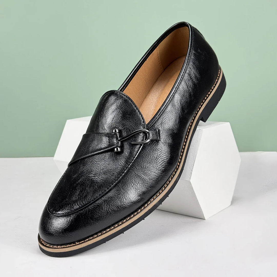 Side profile of men's formal brown leather slip-on bit loafers.