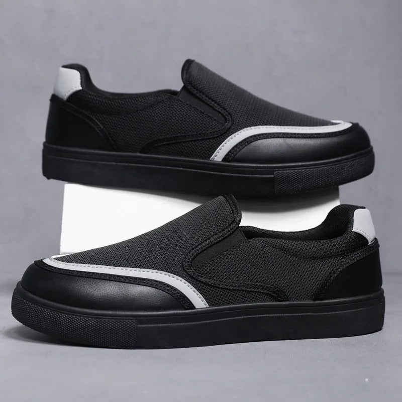 Comfortable men's deck shoes in a classic slip-on design, ideal for all-day wear.