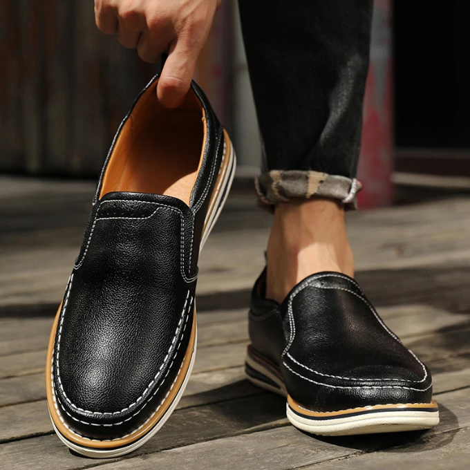 Underside view of the slip-on leather loafers, showing the sole for men's comfortable footwear.
