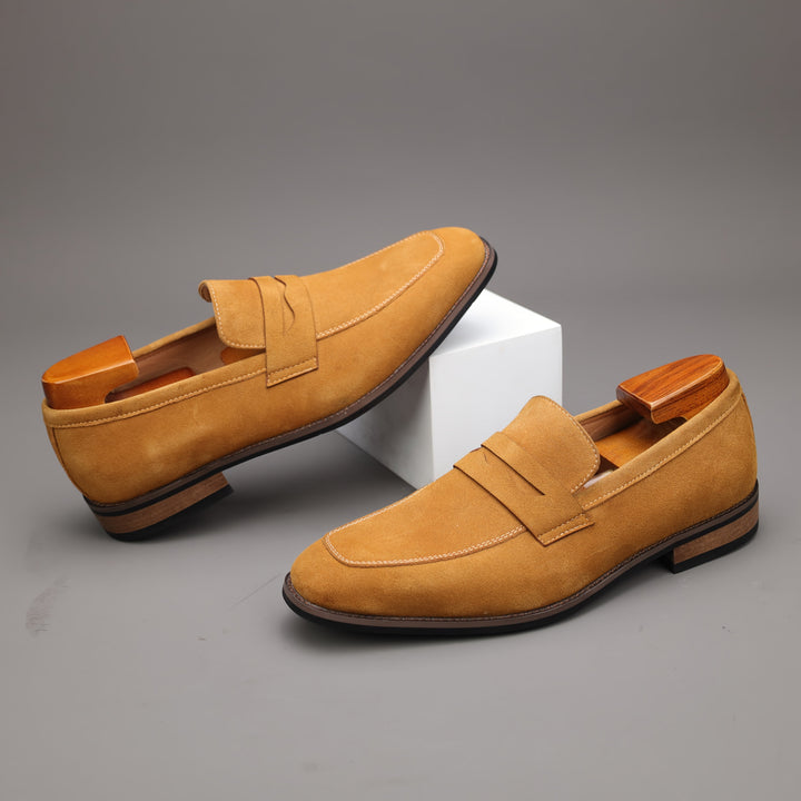 Stylish men's dress loafers, slip-on design in brown, paired with formal trousers for office or events.