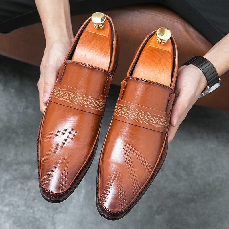 Close-up of a men's classic brown penny loafer, highlighting the polished finish and slip-on convenience.