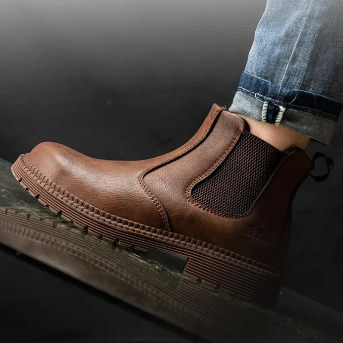 Pair of rugged men's steel toe Chelsea boots, ideal for heavy-duty work and industrial use