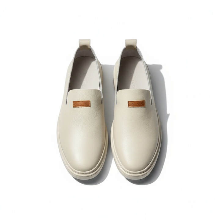 Men's classic leather loafers in a deep forest green, adding a unique touch to casual fashion