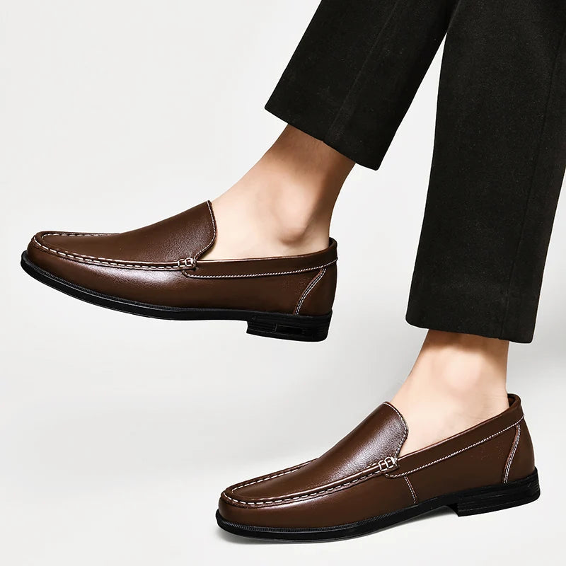 Front view of men's sleek leather loafers, a staple in classic men's shoe collections.