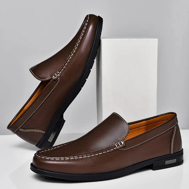 Side profile of a classic men's slip-on leather loafer, perfect for professional or relaxed settings.