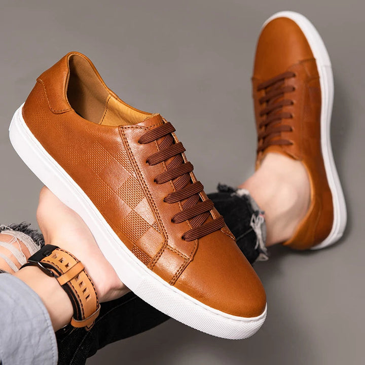 Stylish men's black leather low-top sneakers, perfect for versatile casual footwear and men's fashion