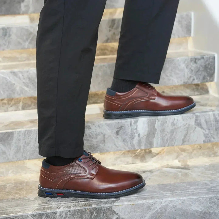 Front view of men's polished leather dress shoes, ready to complete any formal or smart casual outfit.