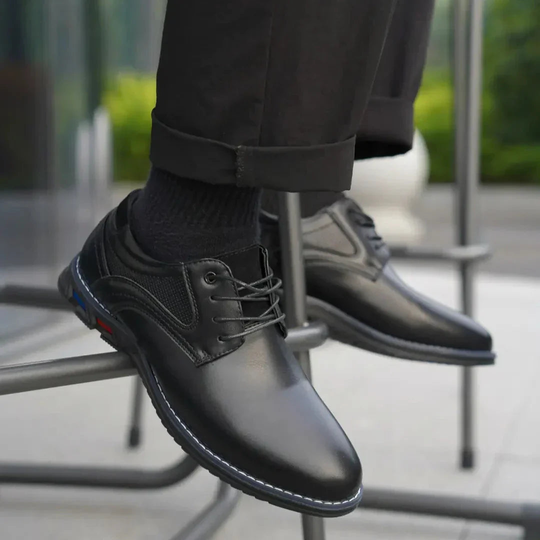 Detail of the leather texture on men's formal dress shoes, showcasing the premium material and durable build.