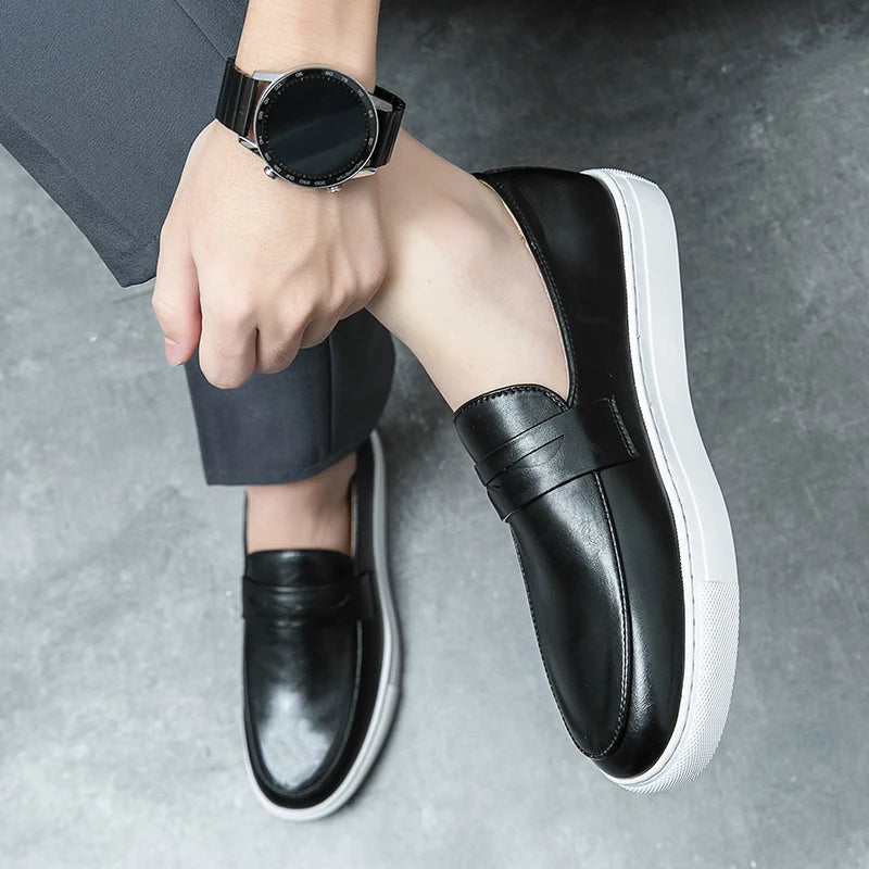 A man wearing classic leather loafers with chino pants, demonstrating smart casual styling.