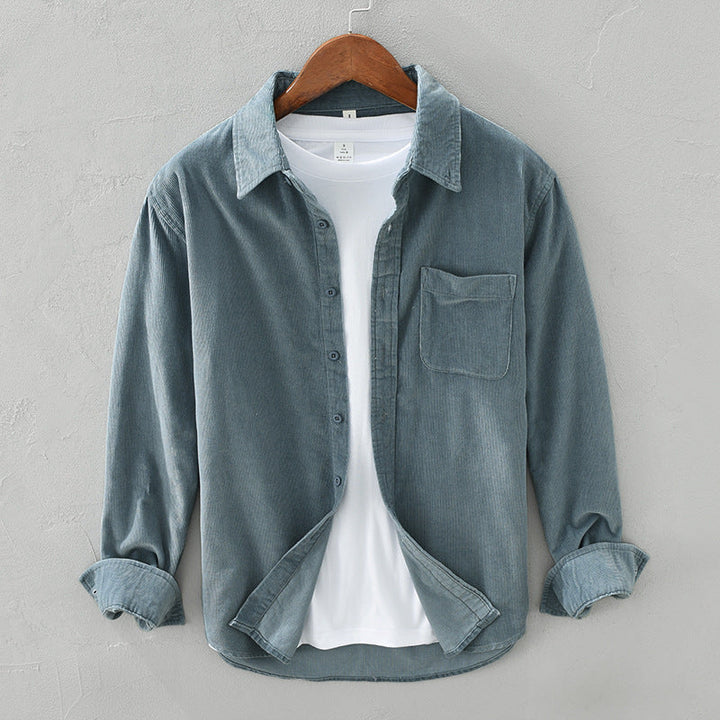Comfortable men's textured long-sleeve button-up shirt, a versatile layering piece for fall & spring fashion.