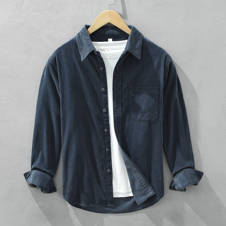 Classic men's casual shirt, a textured long-sleeve button-up with a chest pocket, perfect for comfort wear.