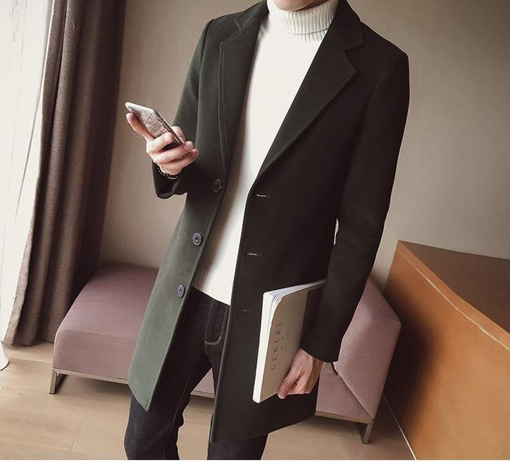 Full-body shot of men's classic black wool blend overcoat against an urban background, autumn fashion