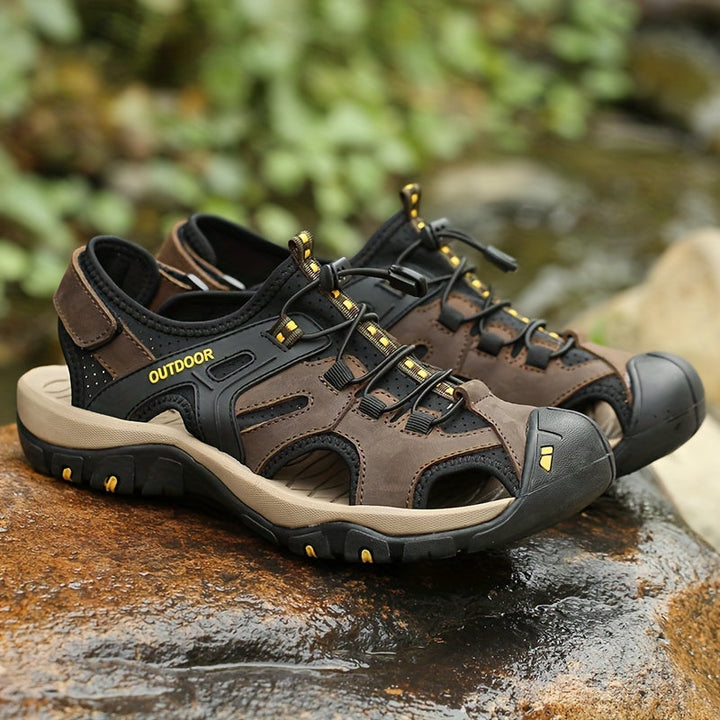 Protective closed-toe men's hiking sandals for rugged trails. Adjustable outdoor summer water adventure footwear.