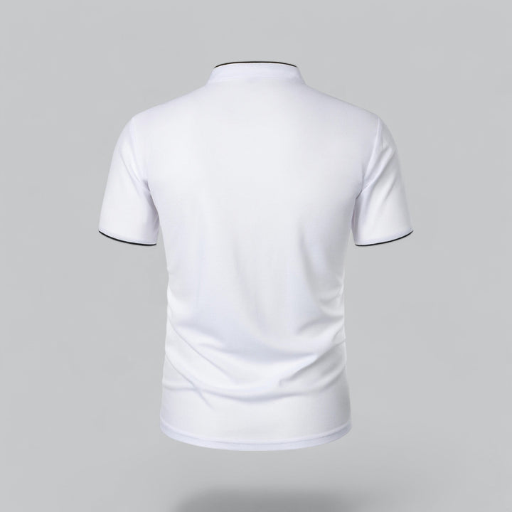 Man standing, wearing a stylish collarless polo shirt, short sleeve, modern fit men's fashion. Casual top.