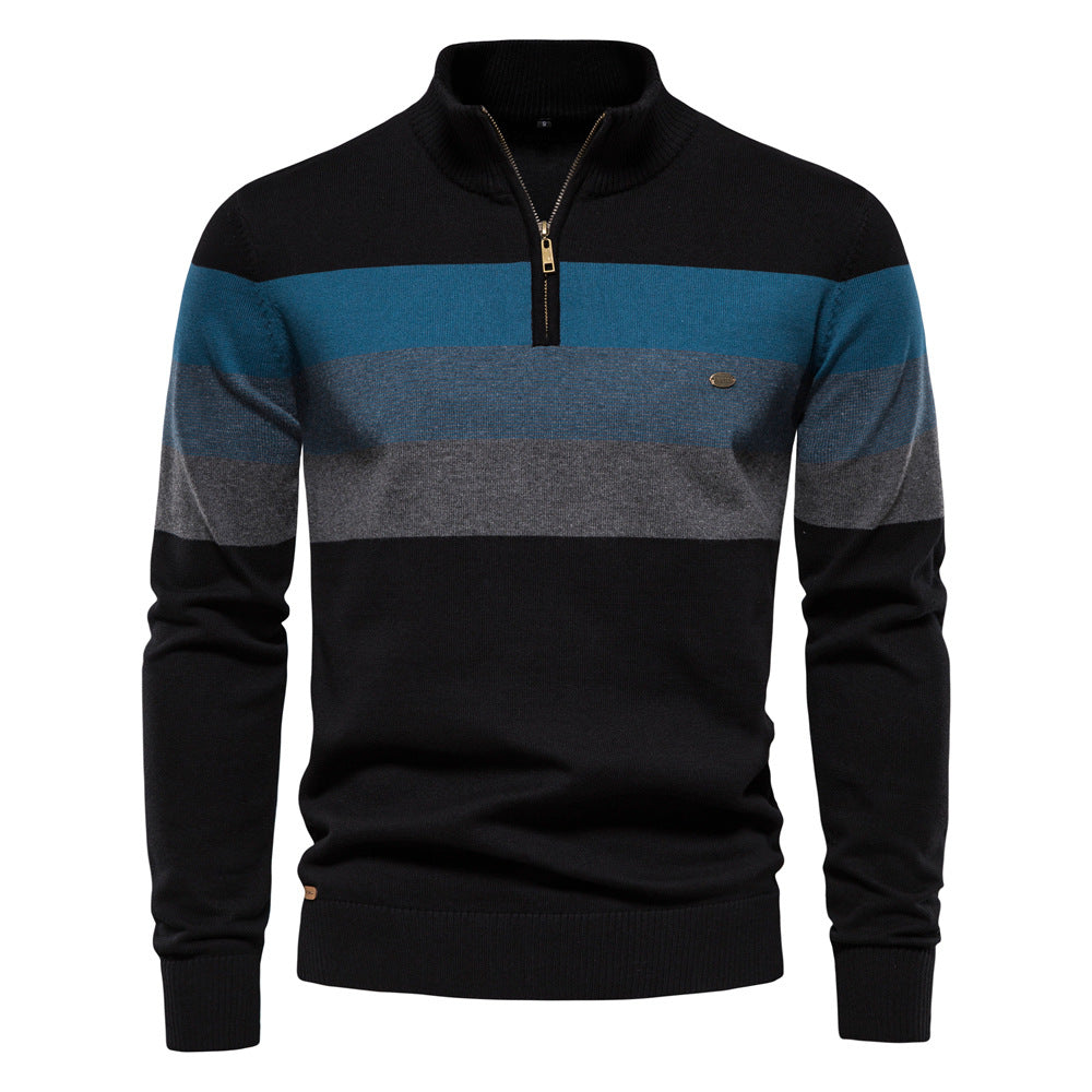 Close-up of the cotton blend fabric on a men's colorblock half-zip pullover, soft texture