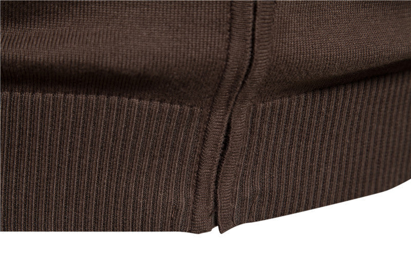 Studio shot of a men's colorblock zip-up cardigan sweater against a neutral background.