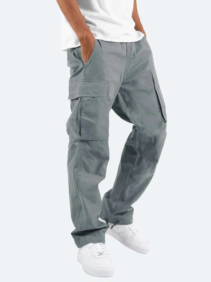Durable men's outdoor cargo pants with a comfortable drawstring closure & reinforced utility pockets for adventuring.