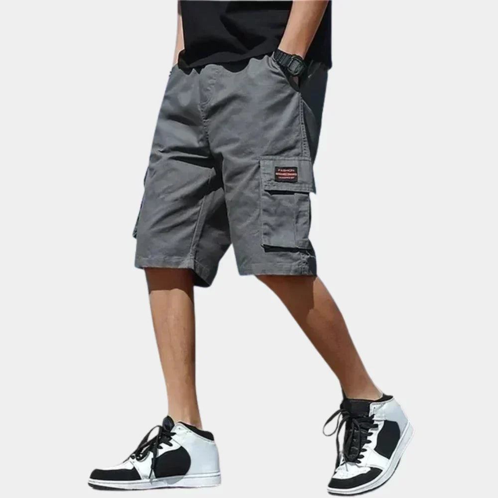 Relaxed fit men's cargo shorts with multi-pockets & drawstring, perfect for casual summer wear.