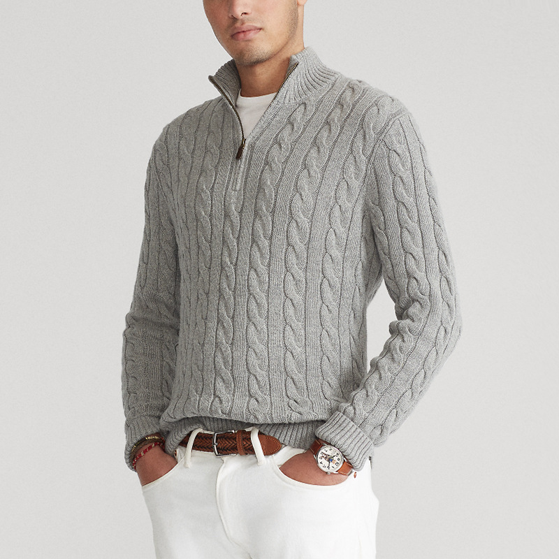 Men's cozy cable knit half-zip sweater in a warm winter layer, perfect for stylish casual wear.