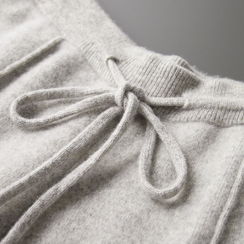 Back view of men's merino blend lounge pants, showing pockets and relaxed fit, soft material.