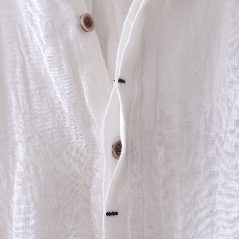 Easy-wear men's crinkle short sleeve top, relaxed button-down style for comfortable summer fashion.