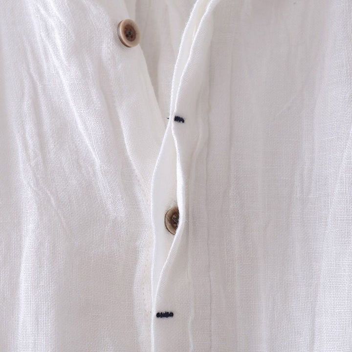 Easy-wear men's crinkle short sleeve top, relaxed button-down style for comfortable summer fashion.