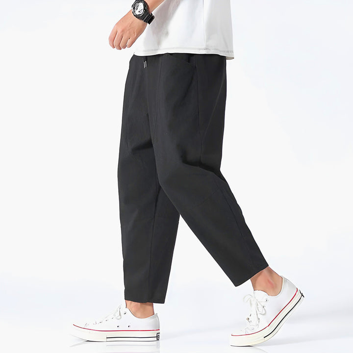 Khaki men's comfortable cropped drawstring chino pants for summer style.