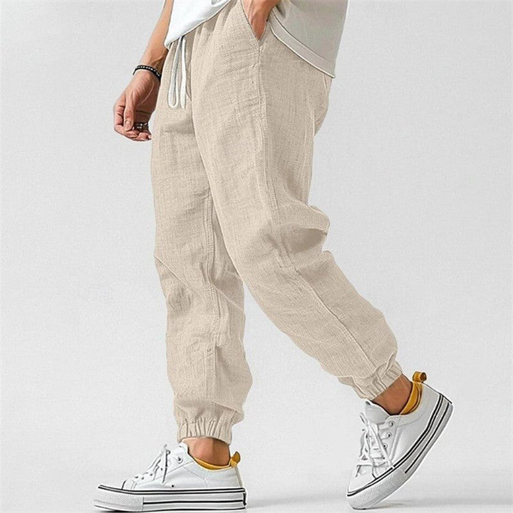 Men's casual joggers trackpants with drawstring waist & cuffed ankles. Comfortable for everyday & travel.