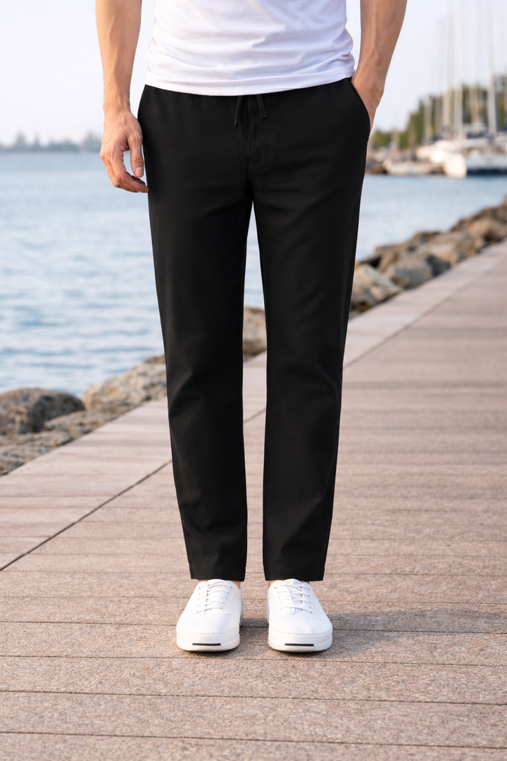 Black men's casual drawstring trousers with a straight leg and elastic waist for comfortable, relaxed everyday style.