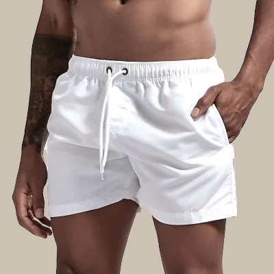 Men's fashion swim shorts with drawstring waist; quick dry for beach, pool & summer vacation.