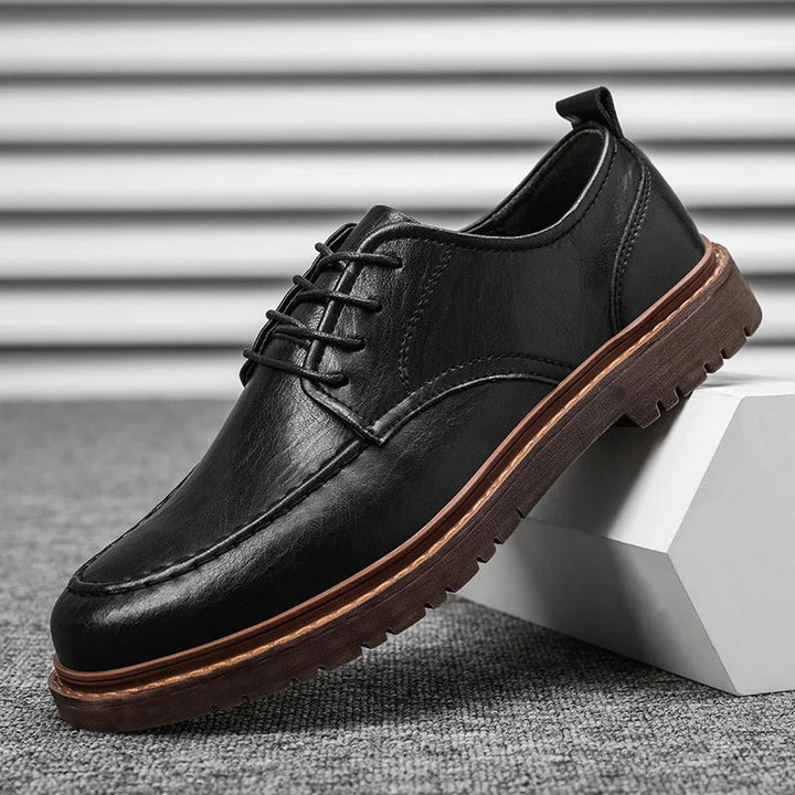 Men's classic blaxck leather slip-on loafers, an essential durable footwear for any wardrobe.