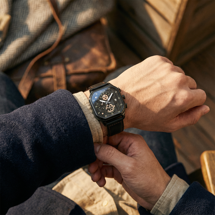 Men's accessories: A durable chronograph watch with a black dial and contrasting luminous hands for clear visibility.