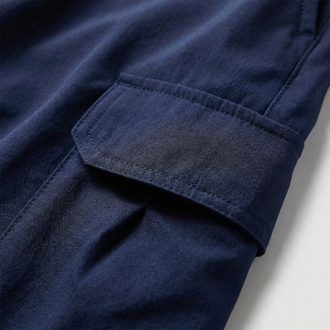 Tactical quick-dry men's shorts, durable for outdoor activities & featuring ample utility pockets.
