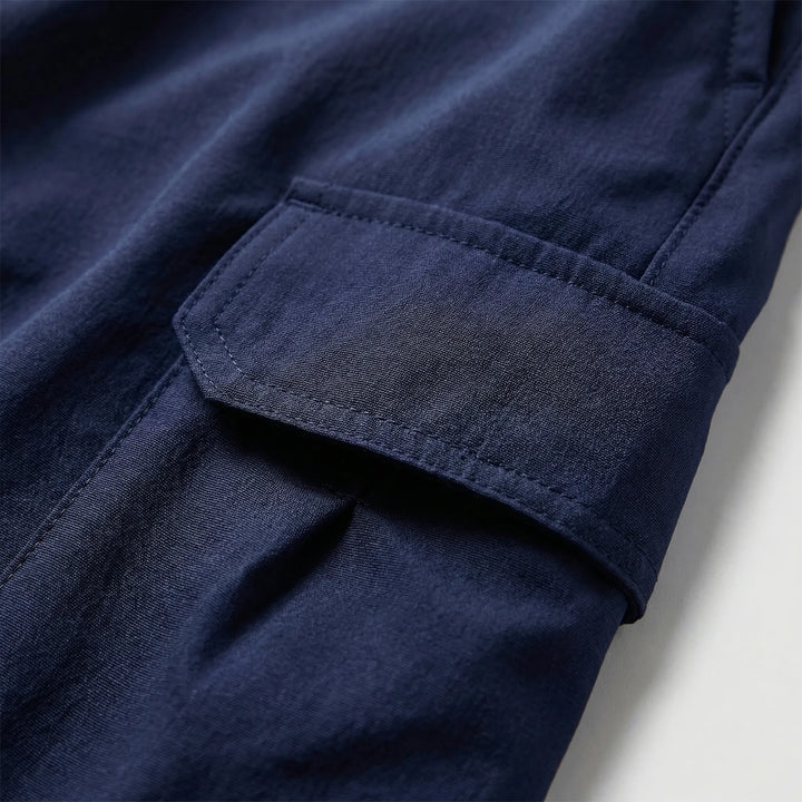 Tactical quick-dry men's shorts, durable for outdoor activities & featuring ample utility pockets.