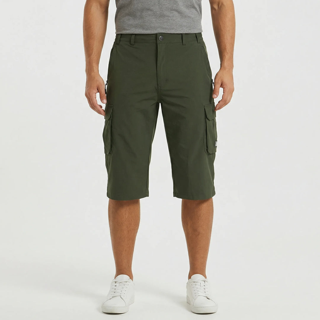 Model wearing Men's Sherman cargo shorts, ready for a hiking trail or travel.