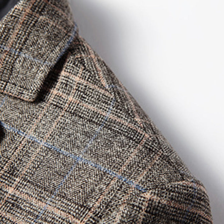 Back view of a tailored men's slim fit blazer jacket, featuring subtle embroidery and a modern silhouette.