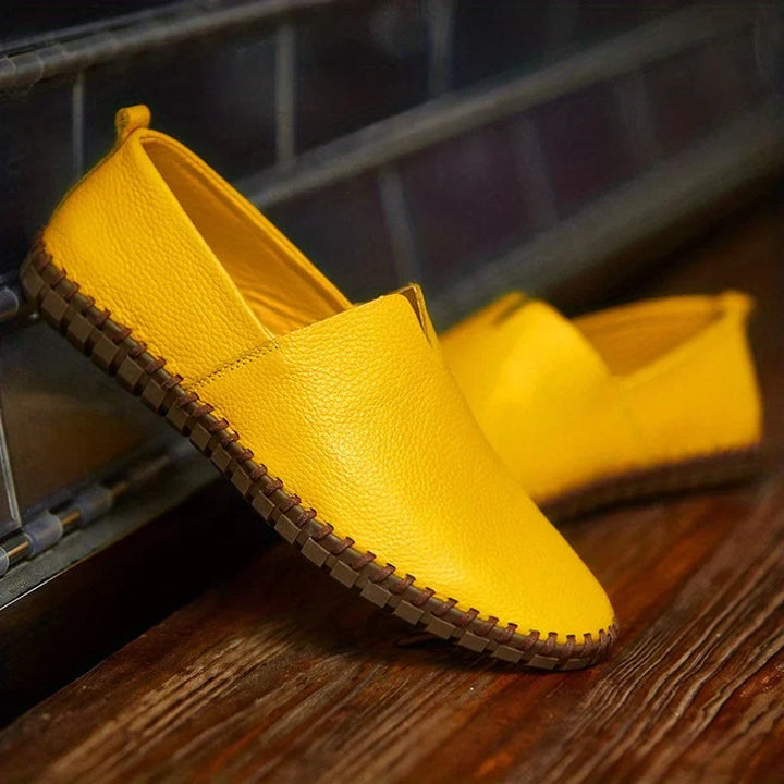 Close-up of men's elegant matte slip-on loafers, showcasing texture and refined craftsmanship.
